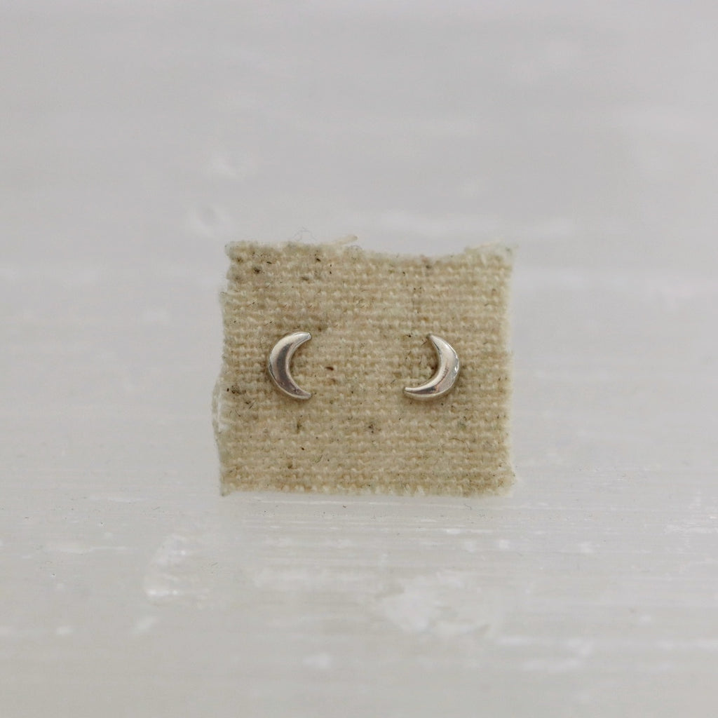 Tiny crescent moon stud earrings in sterling silver 