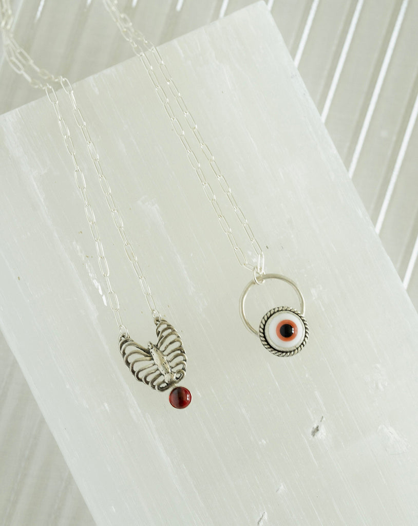 Sterling Silver Ribcage and Red Garnet Necklace