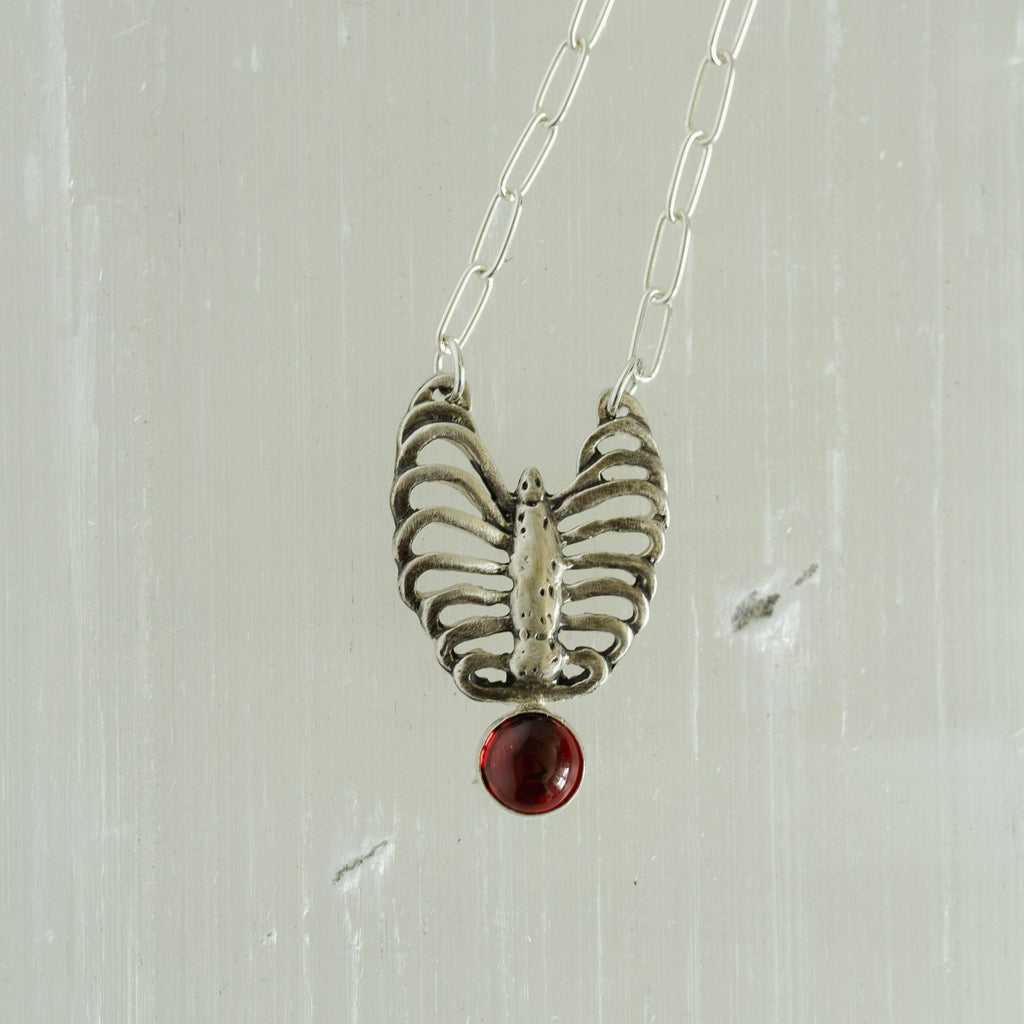 ribcage and garnet necklace in sterling silver