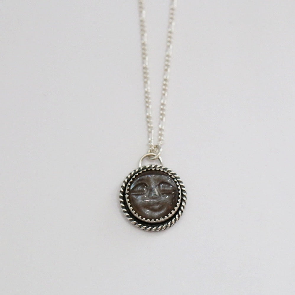 Face in the moonstone necklace