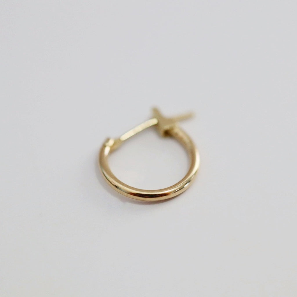Tiny hoop earring in 14 karat gold