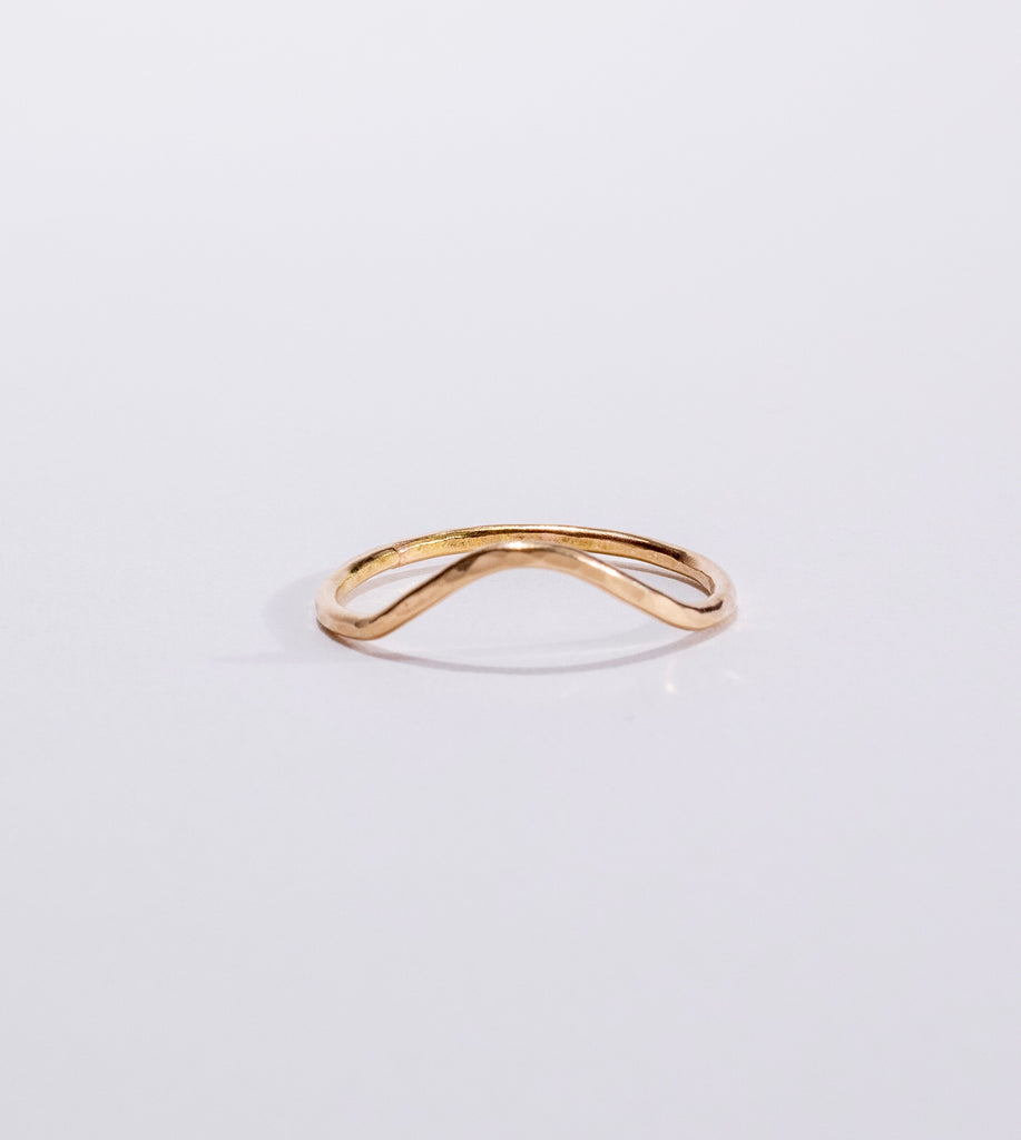 hammered curve stacking ring in 14 karat gold